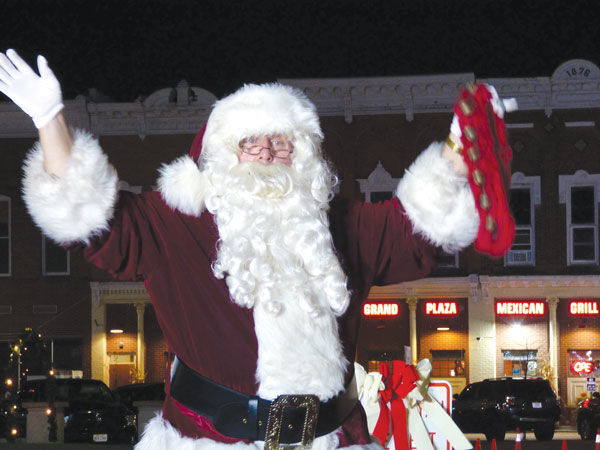 Santa waves to Bryanites from his sleigh